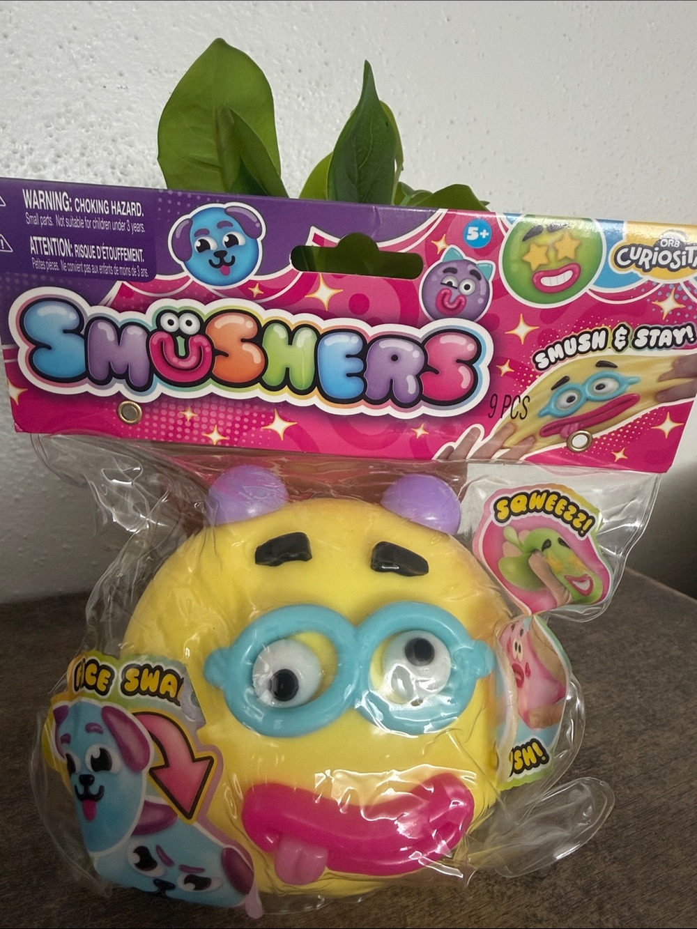 Smushers Yellow Emoji squishy with Blue Glasses and Purple Ear Accents